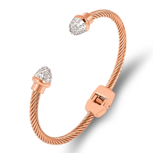 Elegant rose gold cable cuff bracelet featuring pavé crystal conical ends and hinged opening