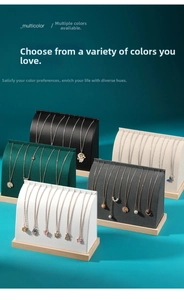Detail of arched velvet jewelry displays with wooden bases in five various colors