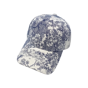 Blue and beige toile de jouy pattern baseball cap with a classic curved brim design