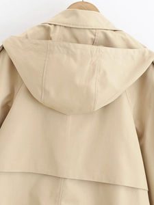 Detail of hood design and precise stitching on the khaki hooded trench coat back