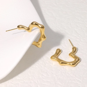 Modern gold wavy heart-shaped stainless steel earrings with fluid metal mirror finish