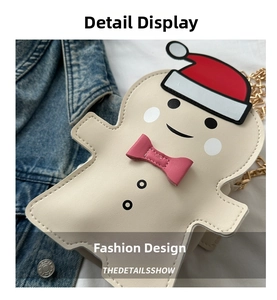Close-up of gingerbread man Christmas crossbody bag featuring festive embroidery and gold chain