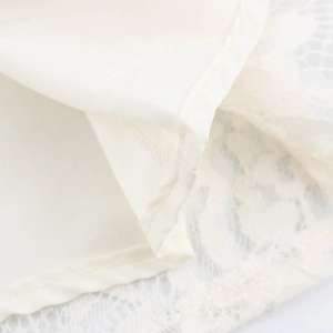 Elegant white lace dress with heart neckline featuring double-stitched hem and soft lining