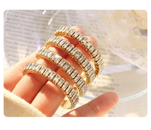 Macro shot of 18K gold plated ring featuring a full circle of rectangular cut zircons