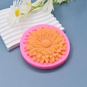 Pink sunflower silicone mold with orange daisy flower sample for DIY cake and candle