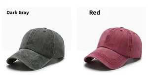 Detail of dark grey and red washed cotton baseball caps showing vintage texture and stitching