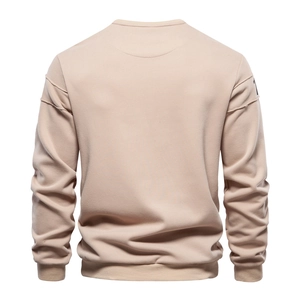 Back view of a beige crewneck sweatshirt featuring dropped shoulders and ribbed hem detail