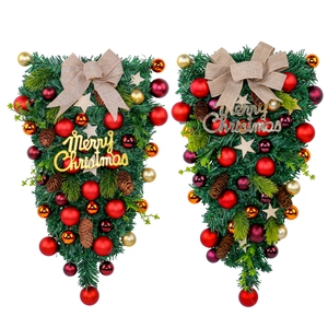 Christmas hanging teardrop swags with red gold balls pinecones and Merry Christmas sign