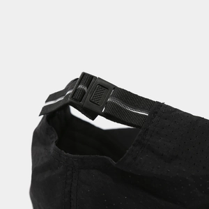 Macro shot of breathable mesh fabric and adjustable buckle on black sports cap