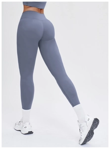 Close-up of high waist yoga leggings in grey blue featuring butt-lifting seam and slim fit