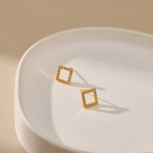 Elegant 18K gold plated square hollow stud earrings with sparkling zircon crystals