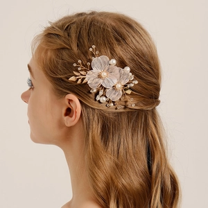 Elegant bridal hair comb with gold floral wire, mesh petals and pearls for wedding styles