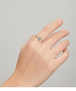 Close-up of S925 sterling silver cat and moon open ring on a model hand
