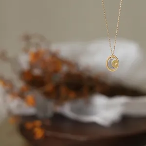 Elegant two-tone moon and star pendant necklace in 18K gold-plated stainless steel chain