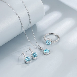 Elegant 925 sterling silver jewelry set featuring blue sapphire heart pendants and rings
