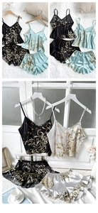 Detailed view of women's silk satin floral pajama set with V-neck camisole and ruffled shorts