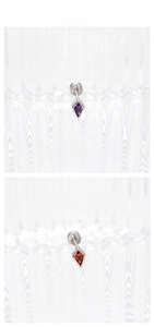 Macro shot of geometric rhombus zircon earrings with secure screw back in purple and orange