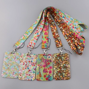 Floral lanyard with card holder set in various spring patterns on gray background