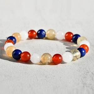 Macro shot of 8mm natural stone beaded bracelet with gradient multicolor gemstones