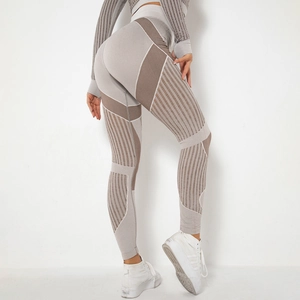 Seamless striped yoga set with long sleeve crop top and high waist leggings for fitness