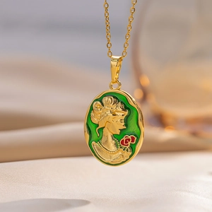 Vintage gold necklace with green enamel portrait pendant featuring a woman holding a red rose