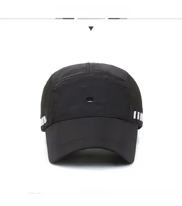 Detail of breathable quick-dry sports cap with white shield logo and side stripes
