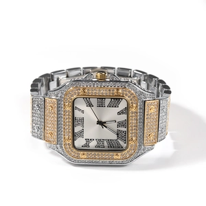 Detailed macro shot of square luxury watch with Roman numerals and iced out crystal bezel