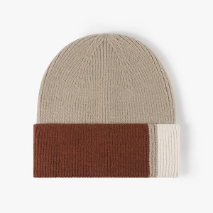 Stylish color-block knit beanie in beige and caramel brown with striped side detail