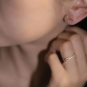 Detail of 925 sterling silver ring and earring set with shimmering micro-pave crystals
