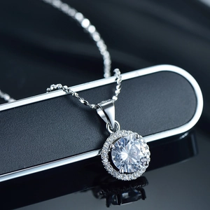 Classic S925 sterling silver halo necklace featuring a round sparkling center stone