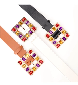 Detailed macro view of fashion belts with colorful square crystal buckles in black and brown