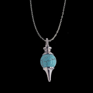 Turquoise natural stone pendant necklace with silver chain on black background