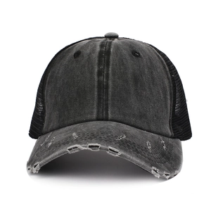 Distressed washed denim ponytail trucker hat with mesh back and vintage baseball style