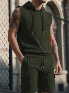 Detail of dark green hooded sleeveless sweatshirt and shorts with marble texture