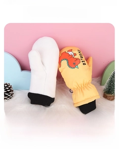 Detail of insulated waterproof kids ski mittens with thick fleece lining and dinosaur print
