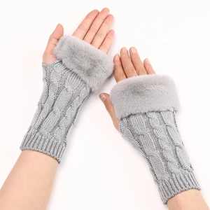 Detail of grey cable knit fingerless glove featuring a plush faux fur trim on the cuff