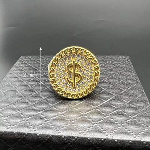 Close-up of gold-plated hip hop ring featuring a 22mm dollar sign set with crystals
