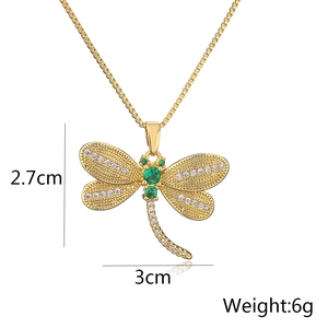 18K gold plated dragonfly pendant necklace with green zircons on a white background