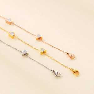 Three-piece triangle charm bracelet set in rose gold, gold, and silver finishes