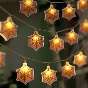 Halloween LED hexagonal star pumpkin string lights with spider web patterns in warm glow