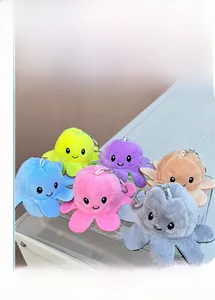 Close-up of colorful reversible plush octopus keychains with metallic ring clips