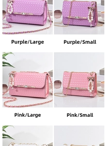 Detail view of woven leather crossbody bag with pearl charms and bow metal buckle decoration