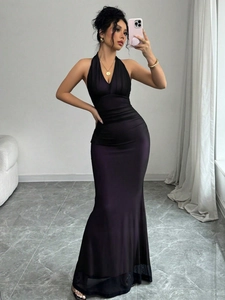 Close-up of deep purple satin halter dress with elegant deep V-neck and mesh details