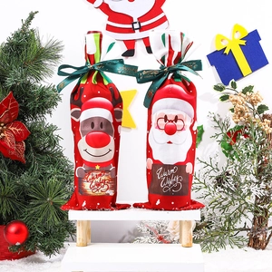 Detail of Christmas wine bottle covers featuring Santa and Reindeer with Warm Wishes print