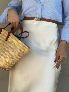 Elegant white silk maxi skirt for women featuring a minimalist bodycon fit and smooth finish