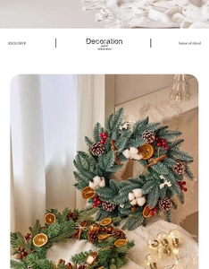 Close-up of festive Christmas wreath with pine cones, red berries, and warm LED lights