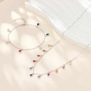 Macro shot of S925 sterling silver colorful zircon teardrop necklace and anklet set