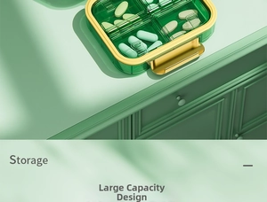 Green portable medicine storage case with four compartments for capsules and gold trim
