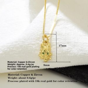 Detailed 18k gold plated wolf head pendant with green zircon eyes and 17x8mm dimensions