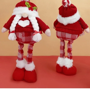 Detail view showing front and back of plush Christmas gnome with red boots and knit hat